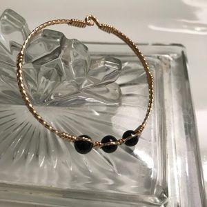 Ronaldo designer jewelry gold and onyx bracelet.